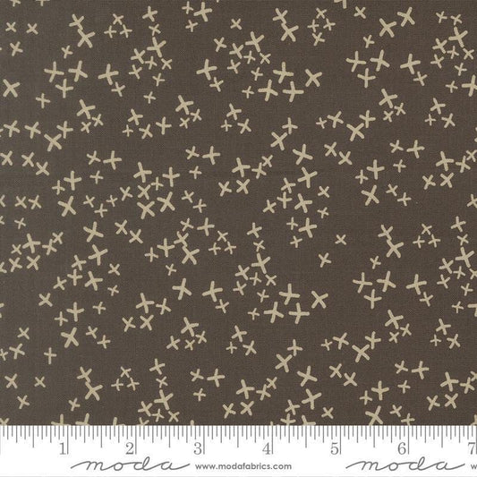 Image of Mira Realm Charcoal quilting cotton fabric by Zen Chic for Moda Fabrics. Features crosses on a brown background. Cute Little Fabric Shop.