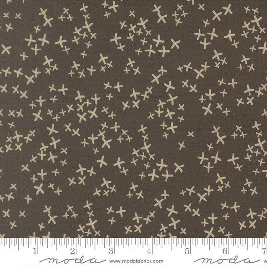 Image of Mira Realm Charcoal quilting cotton fabric by Zen Chic for Moda Fabrics. Features crosses on a brown background. Cute Little Fabric Shop.