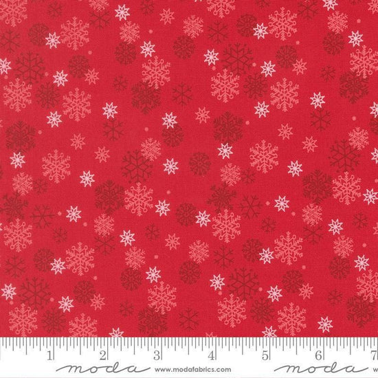 Image of Holiday Cheer Snowflake Poinsettia quilting cotton fabric by Stacy Iest Hsu for Moda Fabrics. Features snowflakes on a red background. Cute Little Fabric Shop.