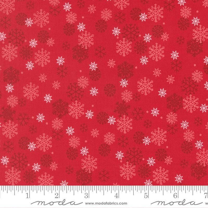 Image of Holiday Cheer Snowflake Poinsettia quilting cotton fabric by Stacy Iest Hsu for Moda Fabrics. Features snowflakes on a red background. Cute Little Fabric Shop.