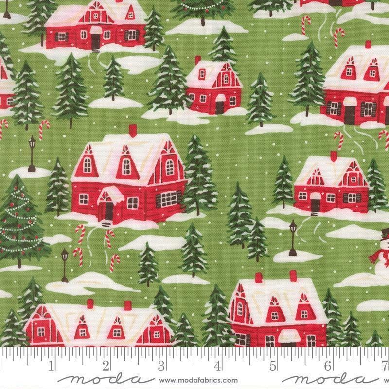 Image of Holiday Cheer Cardinals Village Mistletoe quilting cotton fabric by Stacy Iest Hsu for Moda Fabrics. Features a village on a green background. Cute Little Fabric Shop.