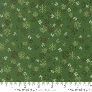 Image of Holiday Cheer Snowflake Evergreen quilting cotton fabric by Stacy Iest Hsu for Moda Fabrics. Features snowflakes on a green background. Cute Little Fabric Shop.