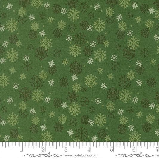 Image of Holiday Cheer Snowflake Evergreen quilting cotton fabric by Stacy Iest Hsu for Moda Fabrics. Features snowflakes on a green background. Cute Little Fabric Shop.