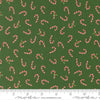 Image of Holiday Cheer Candy Cane Evergreen quilting cotton fabric by Stacy Iest Hsu for Moda Fabrics. Features candy canes on a green background. Cute Little Fabric Shop.