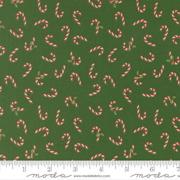 Image of Holiday Cheer Candy Cane Evergreen quilting cotton fabric by Stacy Iest Hsu for Moda Fabrics. Features candy canes on a green background. Cute Little Fabric Shop.