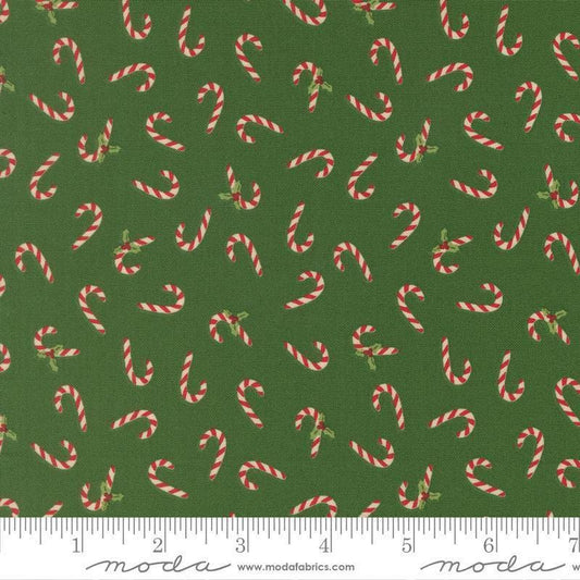 Image of Holiday Cheer Candy Cane Evergreen quilting cotton fabric by Stacy Iest Hsu for Moda Fabrics. Features candy canes on a green background. Cute Little Fabric Shop.