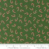 Image of Holiday Cheer Candy Cane Evergreen quilting cotton fabric by Stacy Iest Hsu for Moda Fabrics. Features candy canes on a green background. Cute Little Fabric Shop.