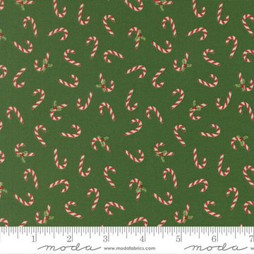 Image of Holiday Cheer Candy Cane Evergreen quilting cotton fabric by Stacy Iest Hsu for Moda Fabrics. Features candy canes on a green background. Cute Little Fabric Shop.