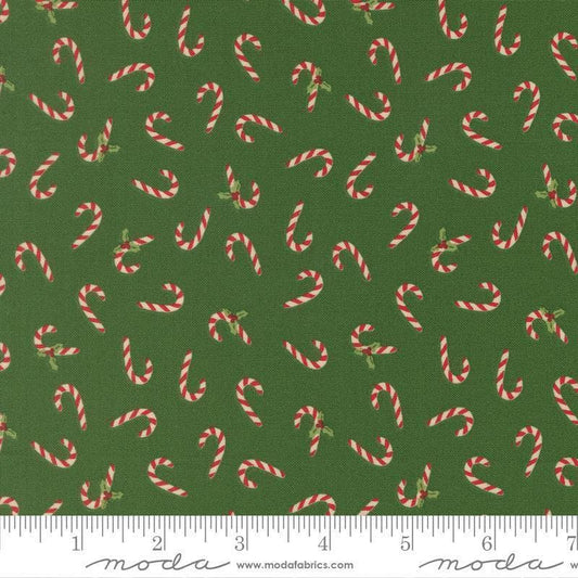 Image of Holiday Cheer Candy Cane Evergreen quilting cotton fabric by Stacy Iest Hsu for Moda Fabrics. Features candy canes on a green background. Cute Little Fabric Shop.