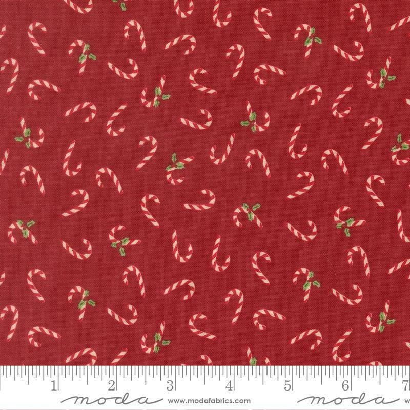 Image of Holiday Cheer Candy Cane Cardinal quilting cotton fabric by Stacy Iest Hsu for Moda Fabrics. Features candy canes on a red background. Cute Little Fabric Shop.