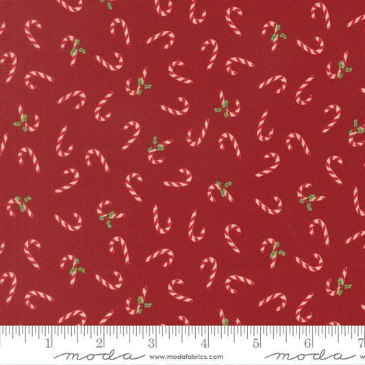 Image of Holiday Cheer Candy Cane Cardinal quilting cotton fabric by Stacy Iest Hsu for Moda Fabrics. Features candy canes on a red background. Cute Little Fabric Shop.