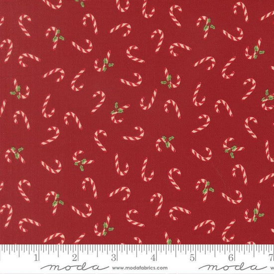 Image of Holiday Cheer Candy Cane Cardinal quilting cotton fabric by Stacy Iest Hsu for Moda Fabrics. Features candy canes on a red background. Cute Little Fabric Shop.