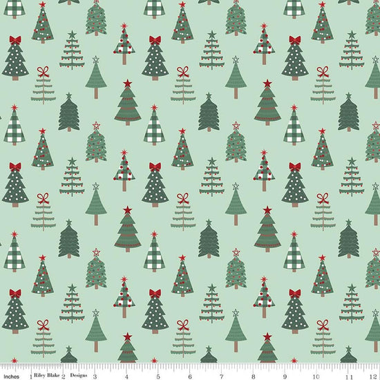 Image of Evergreen Wishes Trees Mint quilting cotton fabric by Traci Reed for Riley Blake Designs. Features trees on a green background. Cute Little Fabric Shop.
