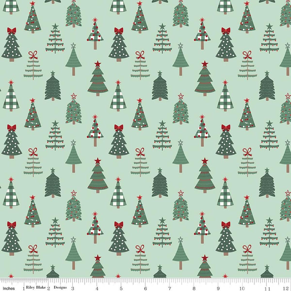 Image of Evergreen Wishes Trees Mint quilting cotton fabric by Traci Reed for Riley Blake Designs. Features trees on a green background. Cute Little Fabric Shop.