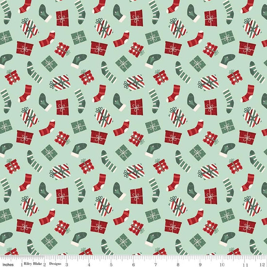 Image of Evergreen Wishes Stockings & Gifts Mint quilting cotton fabric by Traci Reed for Riley Blake Designs. Features presents on a green background. Cute Little Fabric Shop.