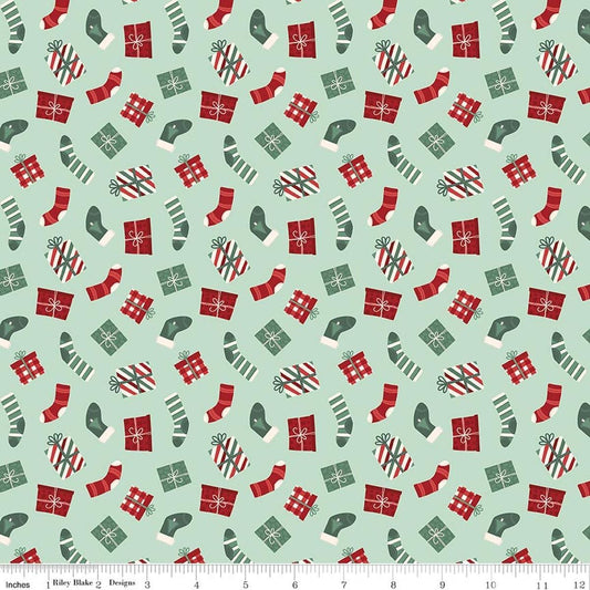 Image of Evergreen Wishes Stockings & Gifts Mint quilting cotton fabric by Traci Reed for Riley Blake Designs. Features presents on a green background. Cute Little Fabric Shop.