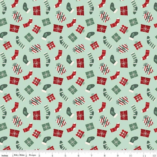 Image of Evergreen Wishes Stockings & Gifts Mint quilting cotton fabric by Traci Reed for Riley Blake Designs. Features presents on a green background. Cute Little Fabric Shop.