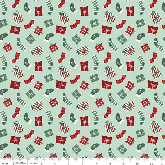 Image of Evergreen Wishes Stockings & Gifts Mint quilting cotton fabric by Traci Reed for Riley Blake Designs. Features presents on a green background. Cute Little Fabric Shop.