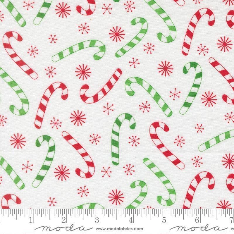 Image of Snow Time Candy Cane Winter White quilting cotton fabric by Me and My Sister Designs for Moda Fabrics. Features candy canes on a white background. Cute Little Fabric Shop.