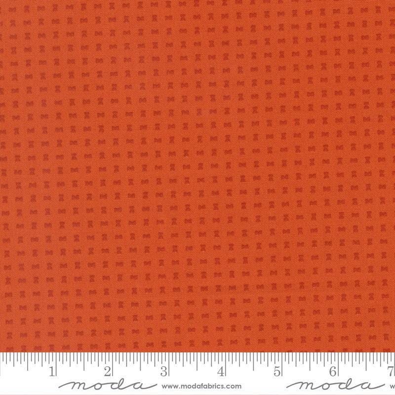 Image of Scenery Spools Yam quilting cotton fabric by Elizabeth Hartman for Moda Fabrics. Features a geometric pattern on an orange background. Cute Little Fabric Shop.