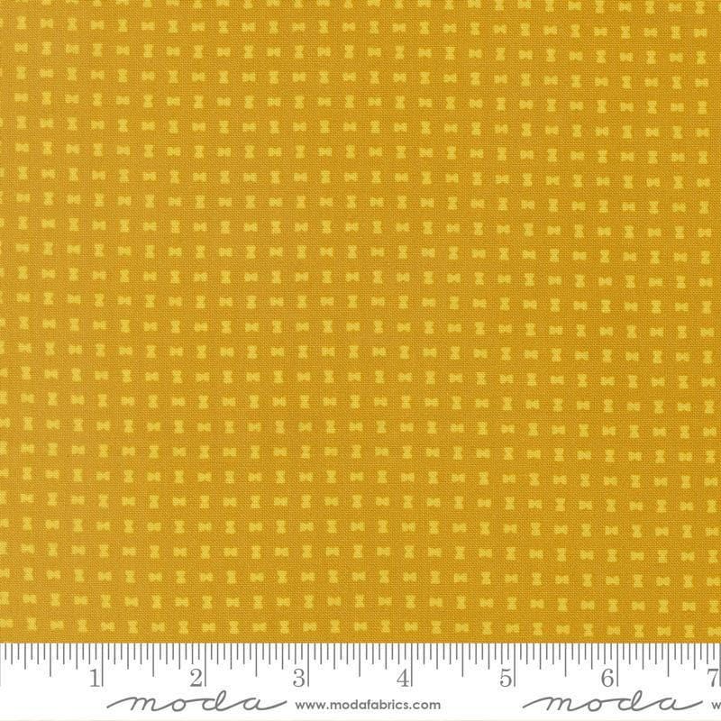Image of Scenery Spool Golden quilting cotton fabric by Elizabeth Hartman for Moda Fabrics. Features a geometric pattern on a yellow background. Cute Little Fabric Shop.
