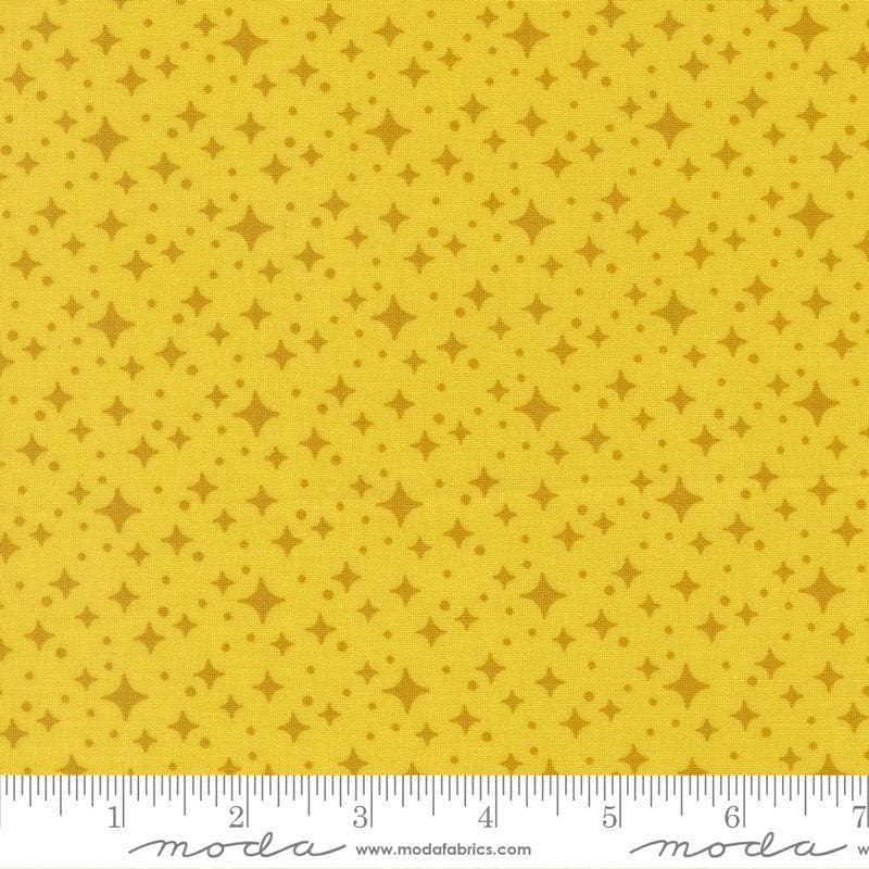 Image of Scenery Starlight Citrine quilting cotton fabric by Elizabeth Hartman for Moda Fabrics. Features stars on a yellow background. Cute Little Fabric Shop.