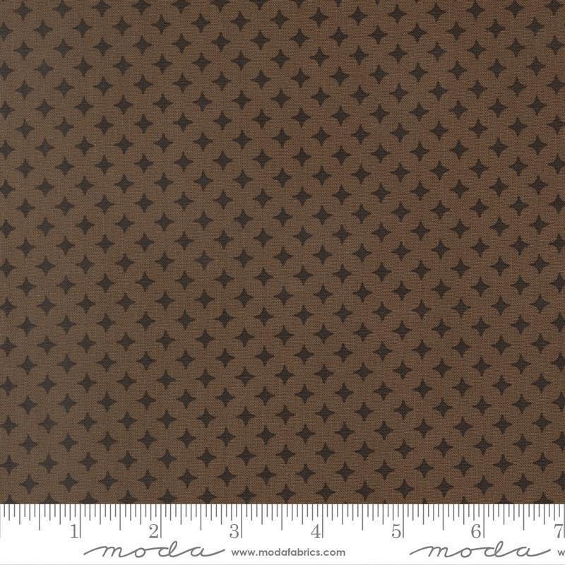 Image of Scenery Diamonds Coal quilting cotton fabric by Elizabeth Hartman for Moda Fabrics. Features a geometric pattern on a black and brown background. Cute Little Fabric Shop.