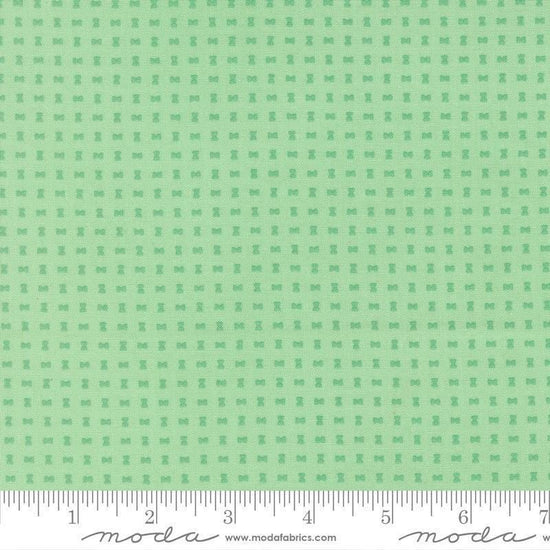 Image of Scenery Spools Aqua quilting cotton fabric by Elizabeth Hartman for Moda Fabrics. Features a geometric pattern on a green background. Cute Little Fabric Shop.