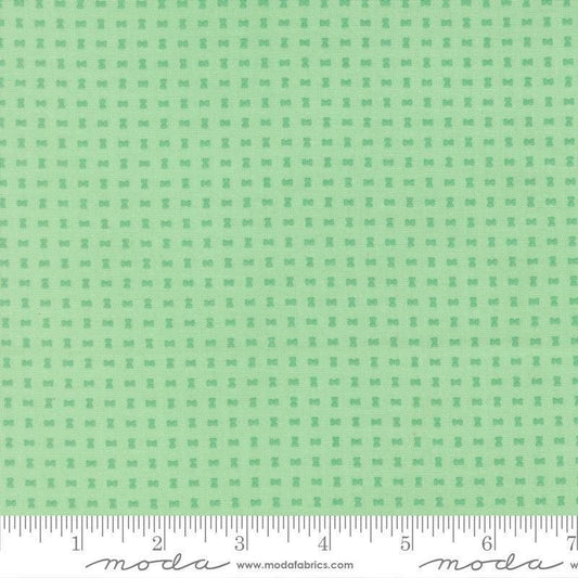 Image of Scenery Spools Aqua quilting cotton fabric by Elizabeth Hartman for Moda Fabrics. Features a geometric pattern on a green background. Cute Little Fabric Shop.