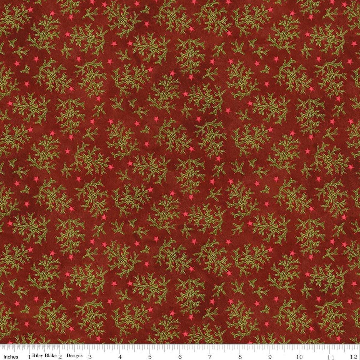Image of Northern Christmas Whimsical Trees Red quilting cotton fabric by Teresa Kogut for Riley Blake Designs. Features leaves on a red background. Cute Little Fabric Shop.