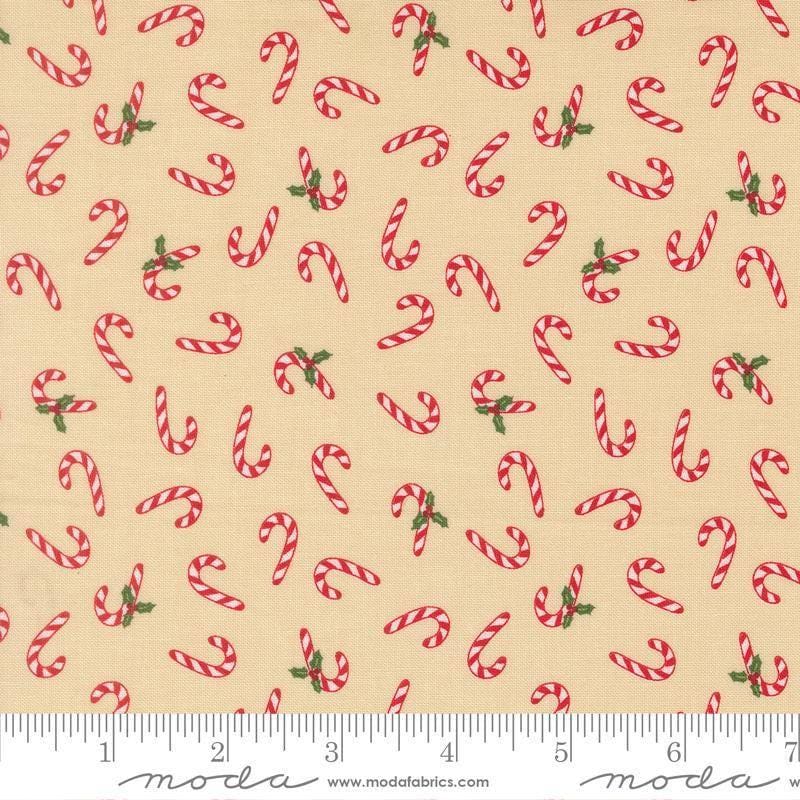 Image of Holiday Cheer Candy Cane Natural quilting cotton fabric by Stacy Iest Hsu for Moda Fabrics. Features candy canes on a cream background. Cute Little Fabric Shop.
