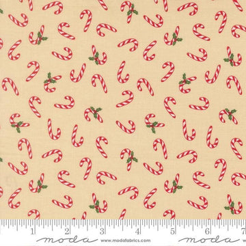 Image of Holiday Cheer Candy Cane Natural quilting cotton fabric by Stacy Iest Hsu for Moda Fabrics. Features candy canes on a cream background. Cute Little Fabric Shop.