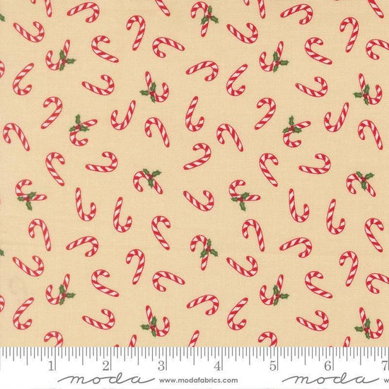 Image of Holiday Cheer Candy Cane Natural quilting cotton fabric by Stacy Iest Hsu for Moda Fabrics. Features candy canes on a cream background. Cute Little Fabric Shop.