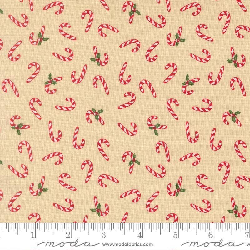 Image of Holiday Cheer Candy Cane Natural quilting cotton fabric by Stacy Iest Hsu for Moda Fabrics. Features candy canes on a cream background. Cute Little Fabric Shop.