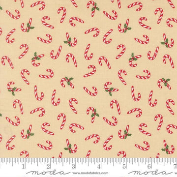 Image of Holiday Cheer Candy Cane Natural quilting cotton fabric by Stacy Iest Hsu for Moda Fabrics. Features candy canes on a cream background. Cute Little Fabric Shop.