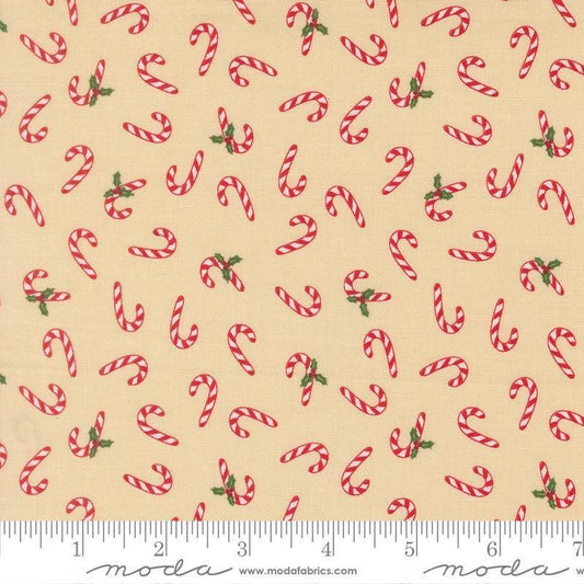 Image of Holiday Cheer Candy Cane Natural quilting cotton fabric by Stacy Iest Hsu for Moda Fabrics. Features candy canes on a cream background. Cute Little Fabric Shop.