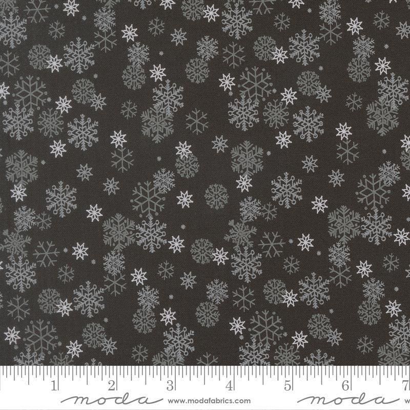 Image of Holiday Cheer Snowflake Midnight quilting cotton fabric by Stacy Iest Hsu for Moda Fabrics. Features snowflake on a black background. Cute Little Fabric Shop.