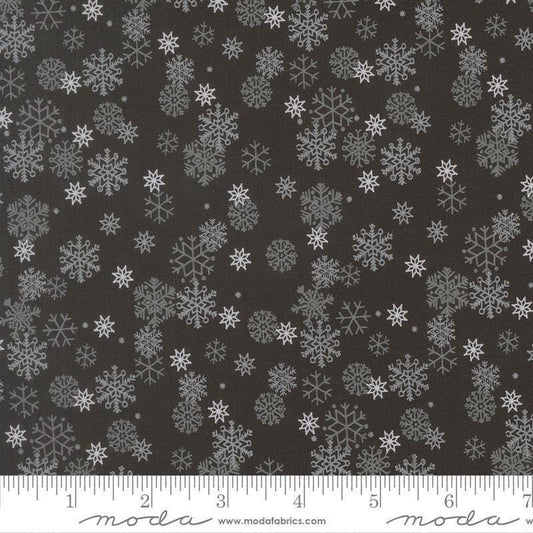 Image of Holiday Cheer Snowflake Midnight quilting cotton fabric by Stacy Iest Hsu for Moda Fabrics. Features snowflake on a black background. Cute Little Fabric Shop.