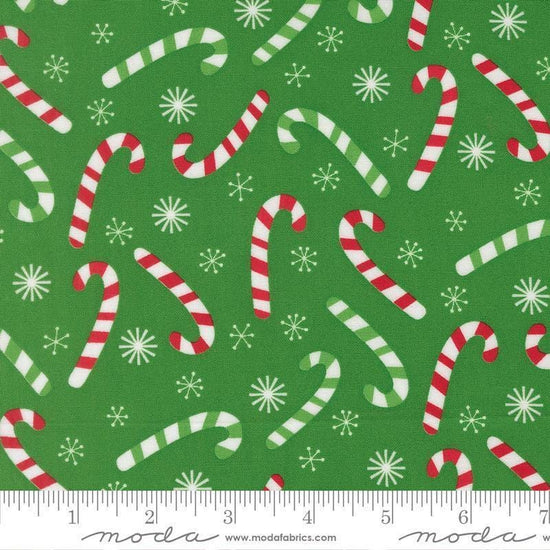 Image of Snow Time Candy Cane Evergreen quilting cotton fabric by Me and My Sister Designs for Moda Fabrics. Features candy canes on a green background. Cute Little Fabric Shop.