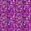 Image of Lumenique Mosaic Blender Magenta quilting cotton fabric by Dan Morris for QT Fabrics. Features a printed stained glass pattern on a purple background. Cute Little Fabric Shop.