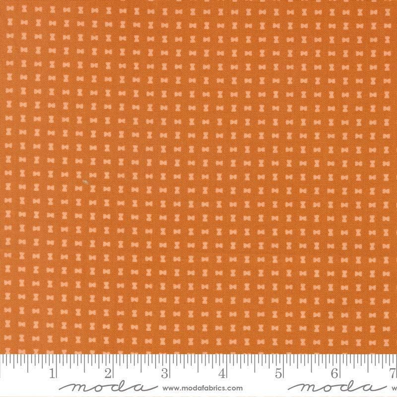 Image of Scenery Spool Pumpkin quilting cotton fabric by Elizabeth Hartman for Moda Fabrics. Features a geometric pattern on an orange background. Cute Little Fabric Shop.