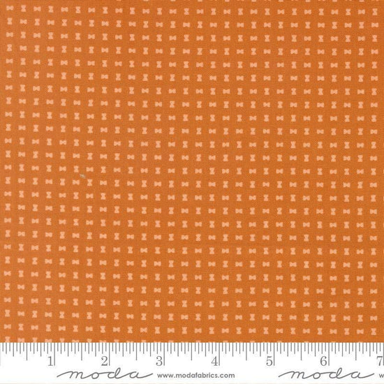 Image of Scenery Spool Pumpkin quilting cotton fabric by Elizabeth Hartman for Moda Fabrics. Features a geometric pattern on an orange background. Cute Little Fabric Shop.