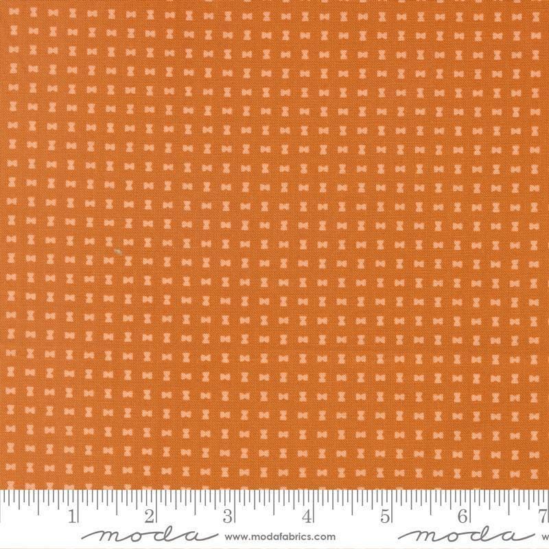 Image of Scenery Spool Pumpkin quilting cotton fabric by Elizabeth Hartman for Moda Fabrics. Features a geometric pattern on an orange background. Cute Little Fabric Shop.