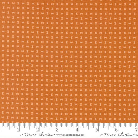 Image of Scenery Spool Pumpkin quilting cotton fabric by Elizabeth Hartman for Moda Fabrics. Features a geometric pattern on an orange background. Cute Little Fabric Shop.