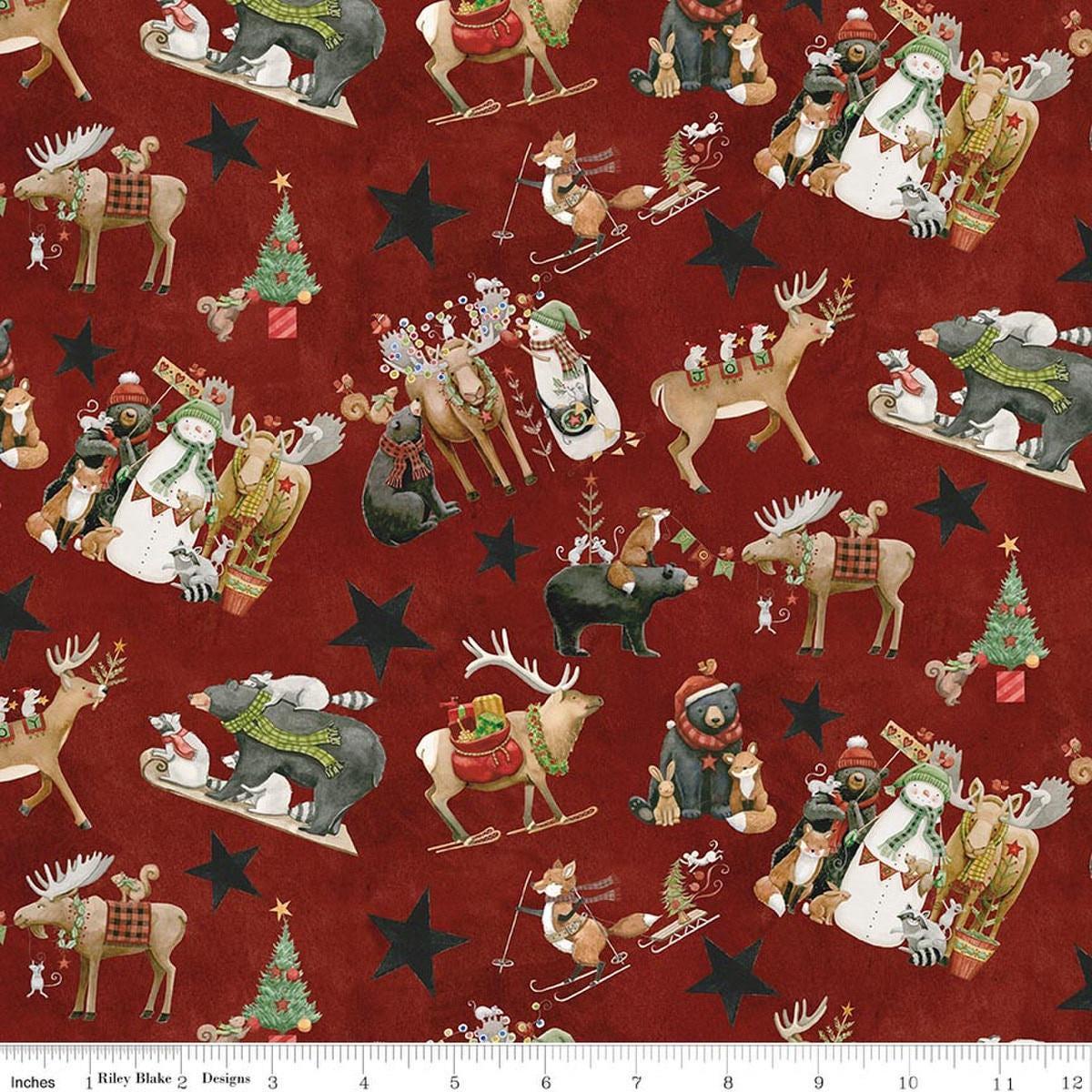 Image of Northern Christmas Main Red quilting cotton fabric by Teresa Kogut for Riley Blake Designs. Features Christmas animals on a red background. Cute Little Fabric Shop.