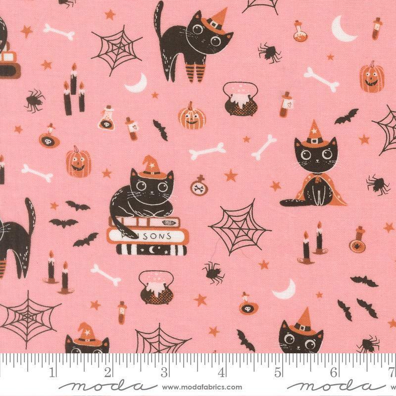 Image of Purrs and Boos Cats Candy quilting cotton fabric by Elena Amo for Moda Fabrics. Features cats and halloween icons on a pink background. Cute Little Fabric Shop.