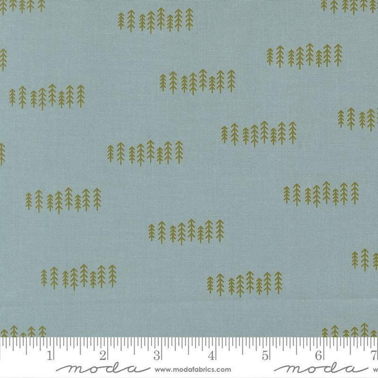 Image of Chilly The Forest Storm quilting cotton fabric by Sweetwater for Moda Fabrics. Features trees on a blue background. Cute Little Fabric Shop.