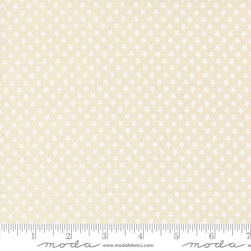 Image of Chilly Star Bright Vanilla White quilting cotton fabric by Sweetwater for Moda Fabrics. Features stars on a cream background. Cute Little Fabric Shop.