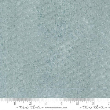 Image of Chilly White Out Storm quilting cotton fabric by Sweetwater for Moda Fabrics. Features printed texture on a blue background. Cute Little Fabric Shop.