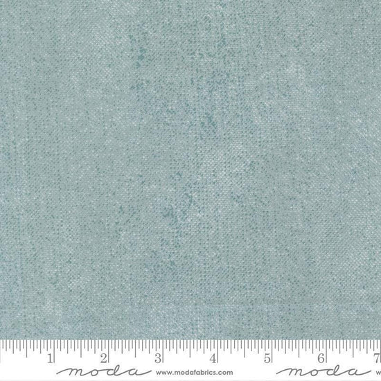 Image of Chilly White Out Storm quilting cotton fabric by Sweetwater for Moda Fabrics. Features printed texture on a blue background. Cute Little Fabric Shop.